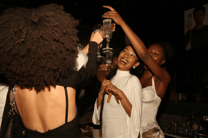 A group of friends celebrates a birthday party at Starchild.